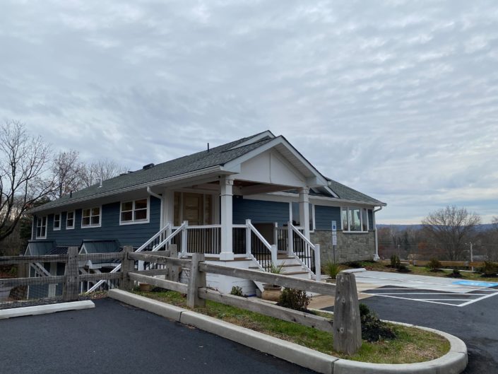 Modern blue house with porch.