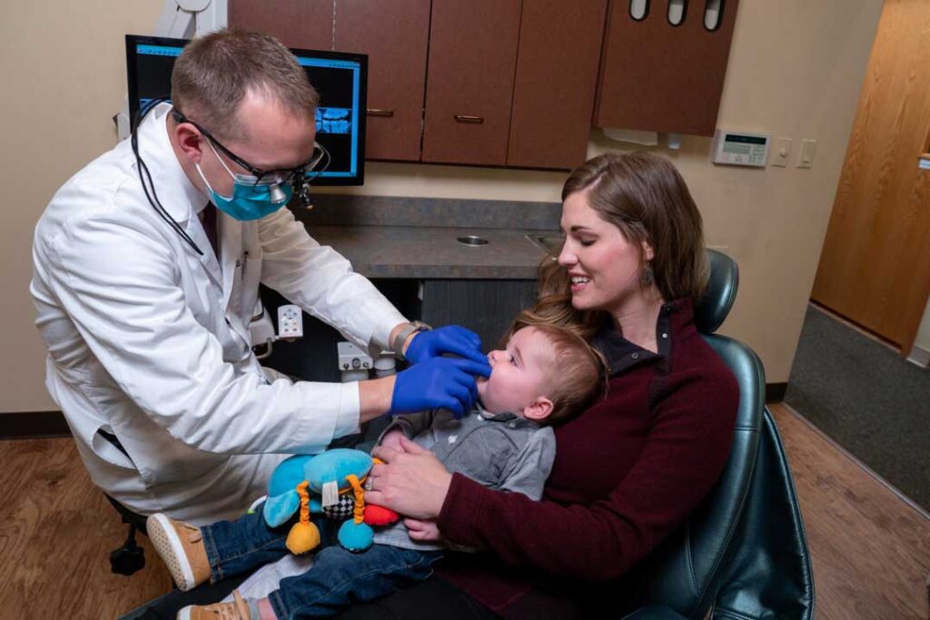 Dentist examining baby's teeth.