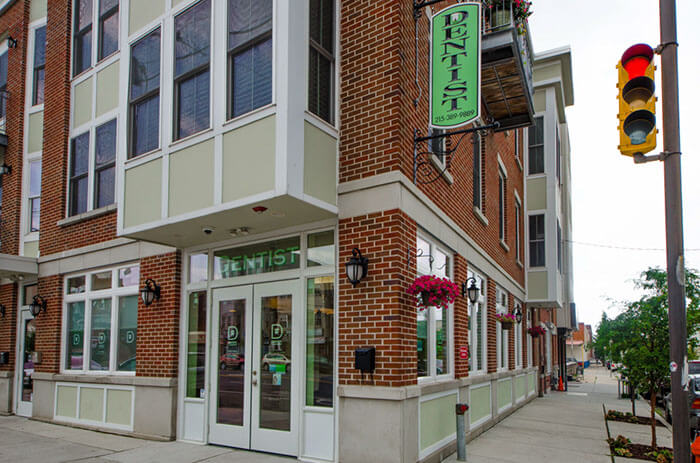 Dentist office building on a street corner.